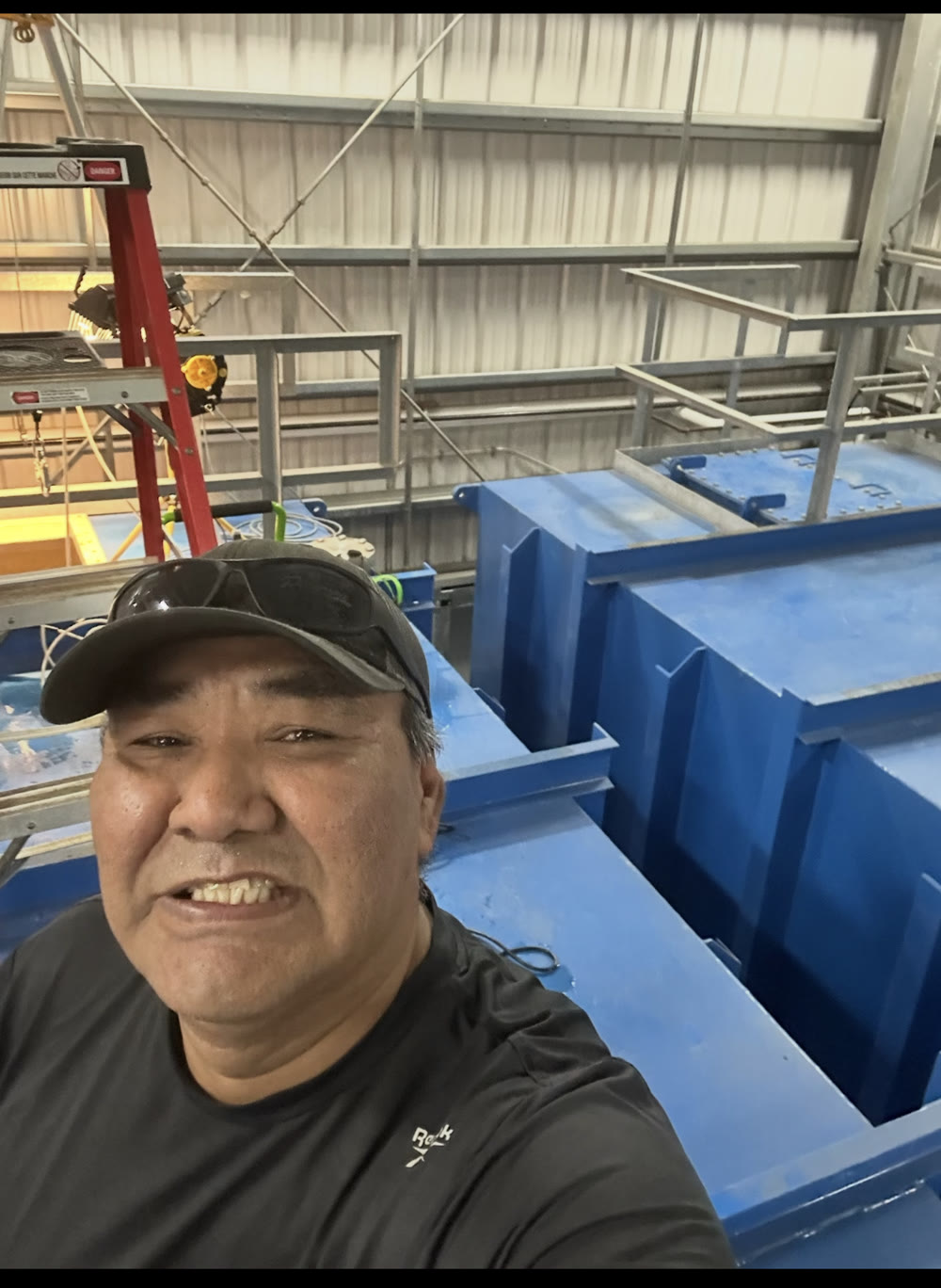 Owner Benjamin Kunnizzie on an industrial work site
