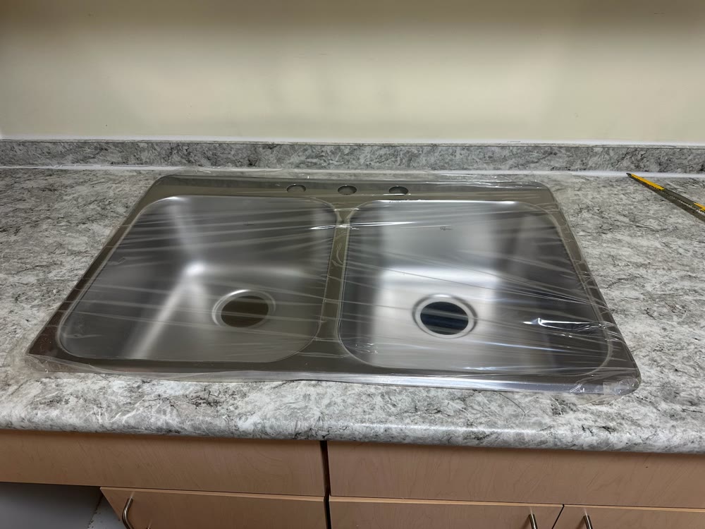 New kitchen sink and countertop installed